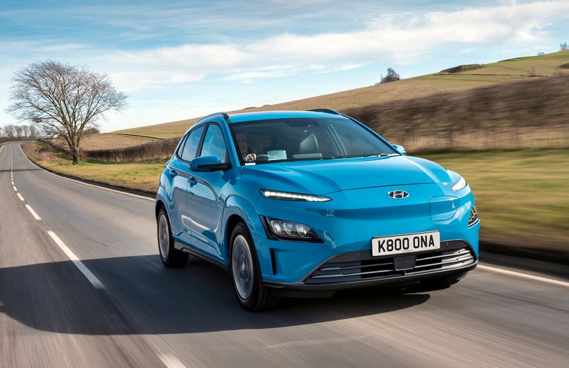 Hyundai Kona electric car driving through countryside